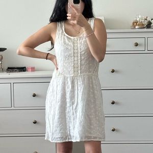 White eyelet embroidered mini dress with slip attached